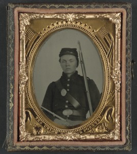A Civil War soldier's photo in a flag-decorated frame