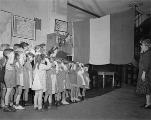 French children at a school in New York City salute their nation's flag on D-day.