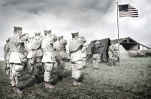 Prior to D-day, American soldiers salute their flag.