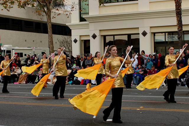 Davis HS Color Guard From Kaysville, Utah waves colored flags as they march in the 2013 Rose Parade. Photo by Prayitno.