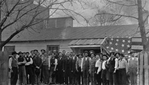 A flag is draped behind quartermasters in Washington in April 1865. (Library of Congress)