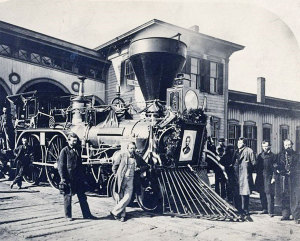 Flags and a wreath decorate one of the engines that pulled Lincoln's funeral train. (Library of Congress)