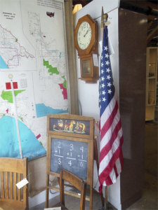 A dealer uses a flag to create a scene at a Monterey shop. (Author photo)