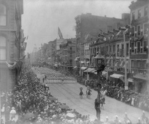 Flags flap as the Grant funeral procession passes by. (Smithsonian Institution)