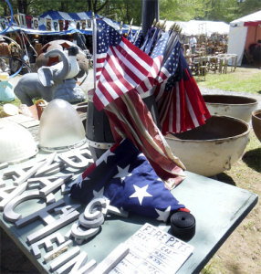 Flags lure customers in Brimfield. (Author photo)