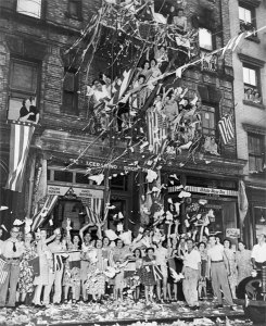 American flags and confetti greet V-J Day news in the Little Italy section of New York City. (Library of Congress)