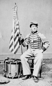 A Civil War drummer boy with flag
