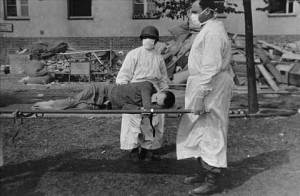 Medical personnel care for a Langenstein survivor