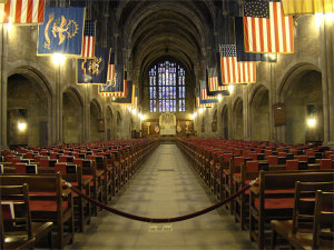 An array of flags hangs over West Point's chapel