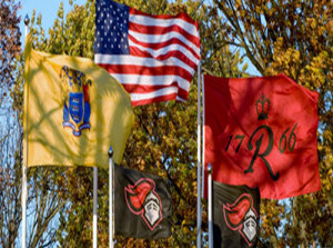 Rutgers' flag flies with American and New Jersey flags