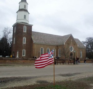 An early American flag flies near Bruton Parish Church in Williamsburg. (Author's photo)