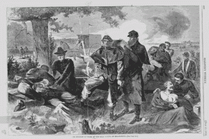Physicians work on wounded men in the midst of battle. (National Archives)