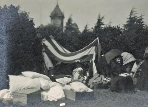 A flag became a makeshift tent after the San Francisco earthquake. (California Historical Society)