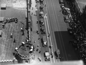 Crowds stare up at a flagpole sitter in Los Angeles ca 1920s. (Digital Public Library of America)