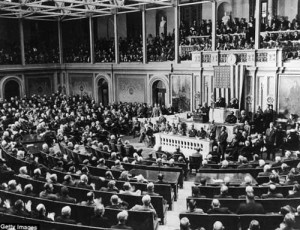 Backed by a huge American flag, FDR delivers his Pearl Harbor speech to Congress on December 8, 1941.