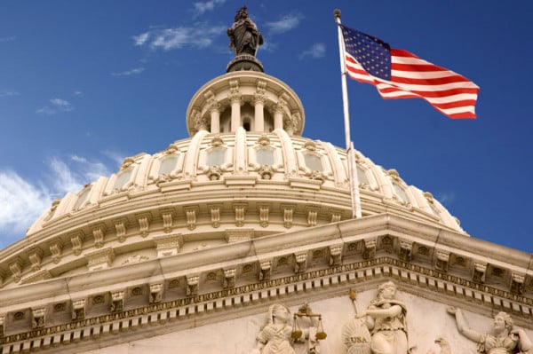 The Capitol displays a flag on a bright day. (wikipedia.org)