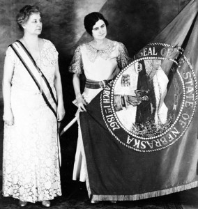 Two women admire the Nebraska flag in 1925. (nebraskahistory.org)