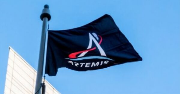 artemis space flag flying against a blue sky