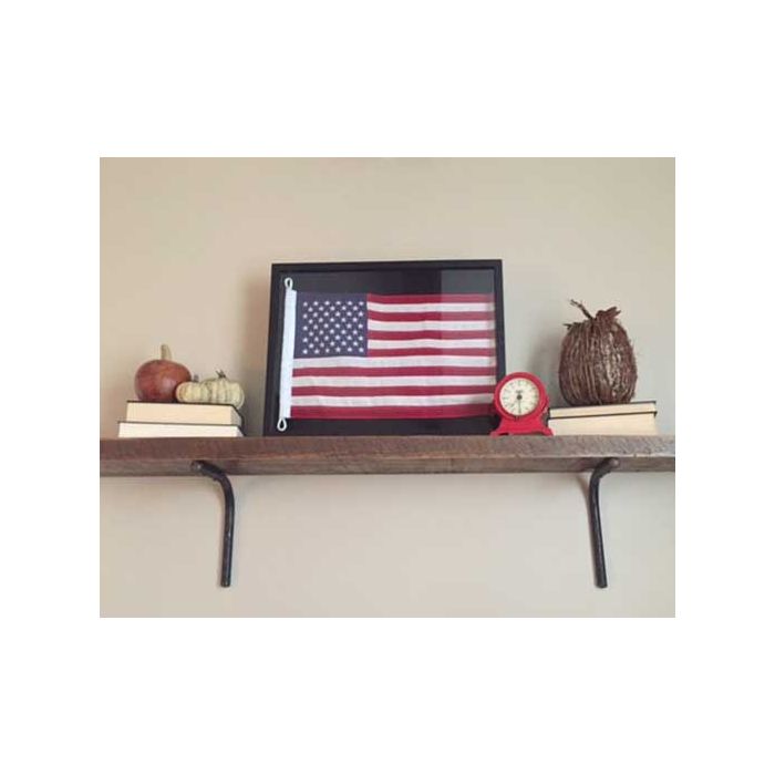 Framed American flag on shelf