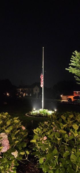 Flagpole lit at night