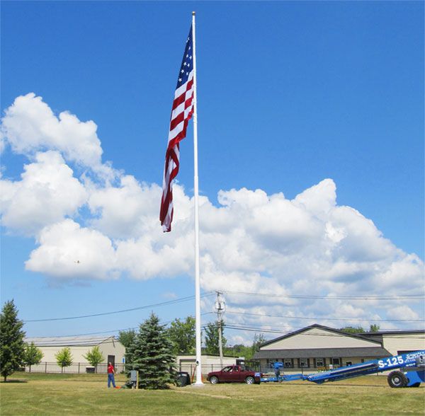 100' White steel flagpole installed at Trustco in Scotia, NY. This pole flies a 30x60' American Flag.