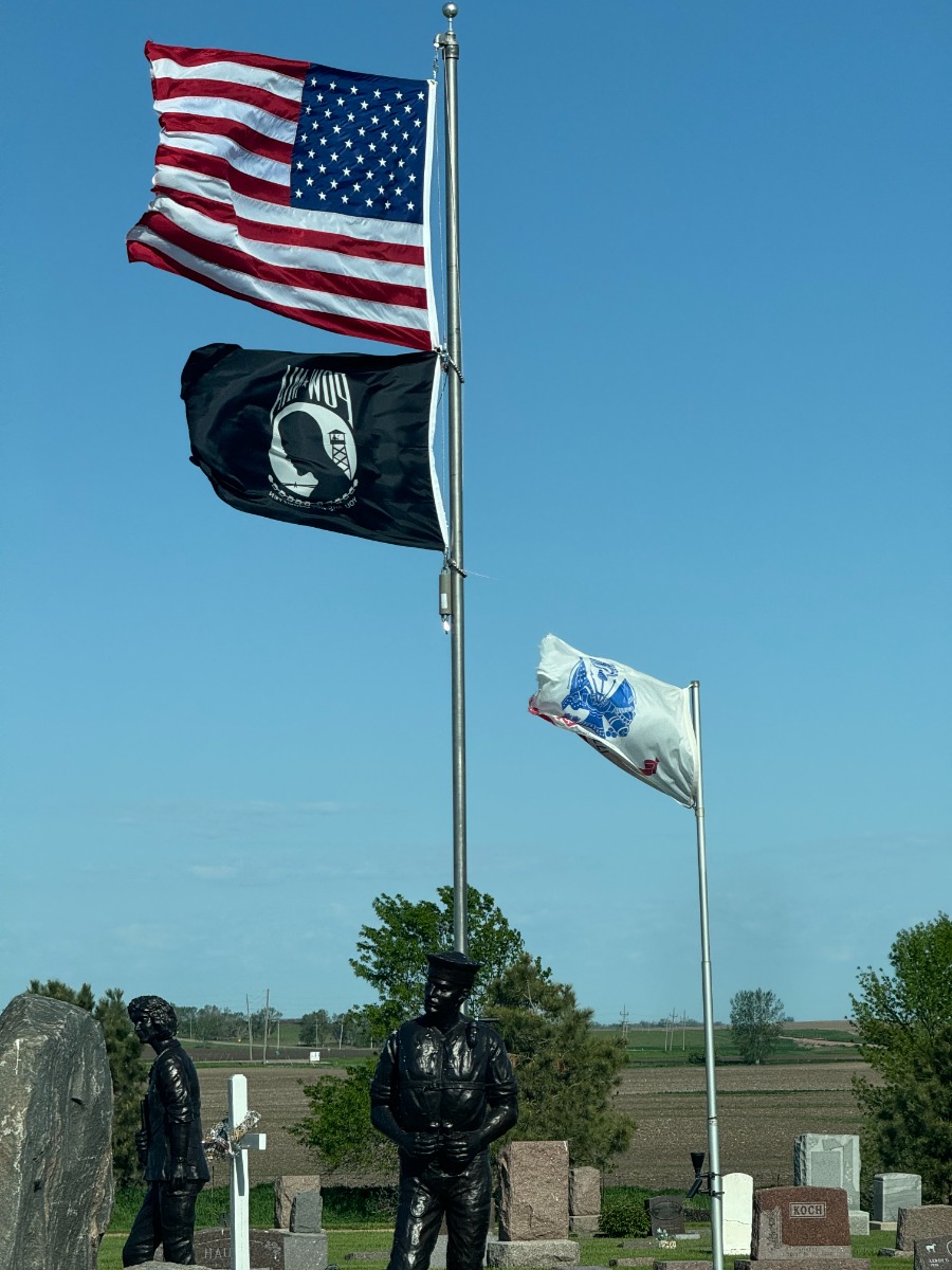 American flag on pole with POW/MIA flag