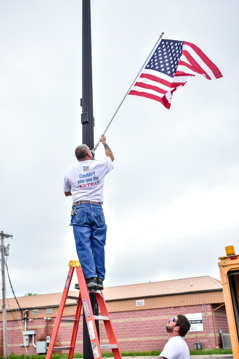 Customer displaying their light pole flag on their own local pole